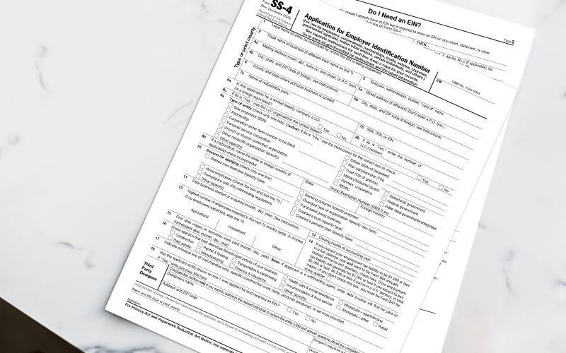 IRS SS-4 Forms on a white marble table