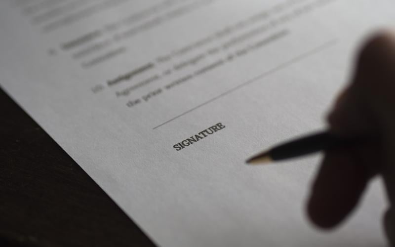 Person signing a contract