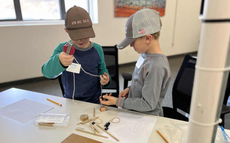 Two boys working on a project.